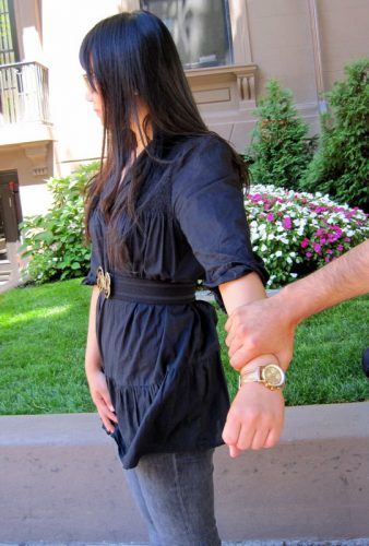Man grabbing woman