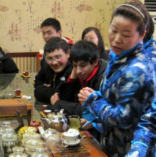 Watching intently at a tea ceremony in Beijing.