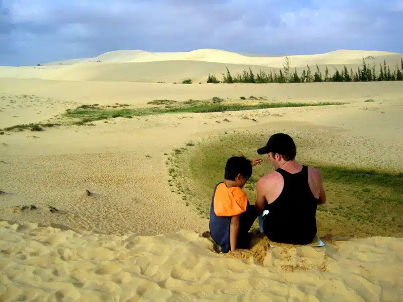Chatting with a Vietnamese boy on the sand dunes.