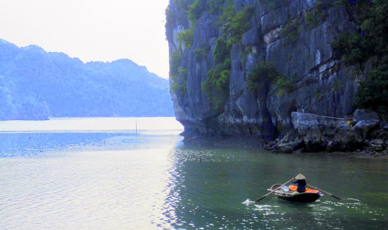 A lone boater in Ha Long Bay.