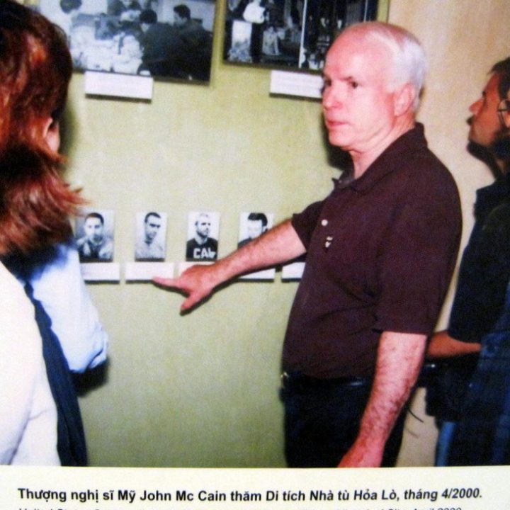 John McCain visiting his former prison.