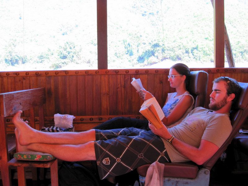 Fellow travelers in Laos reading.