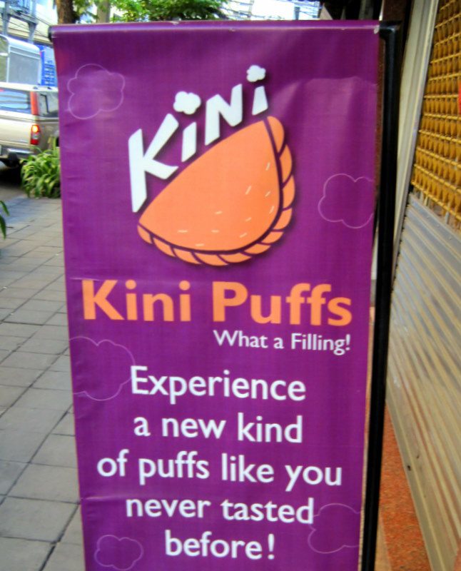 Eating Kini Puffs in Thailand.