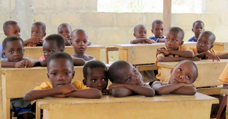 Students sharing desks in rural Ghana.
