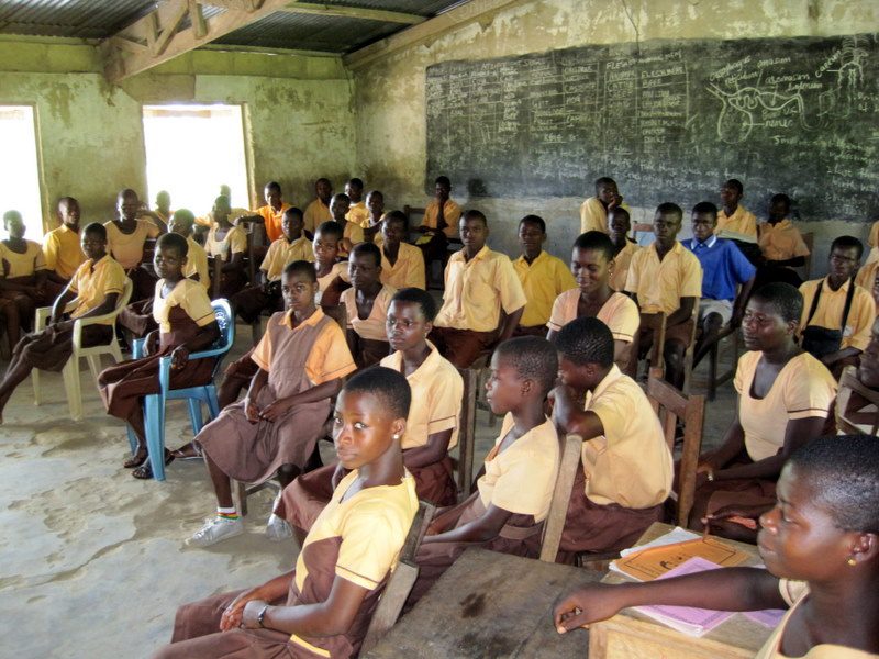 Student uniforms in this area of Ghana are yellow and brown.