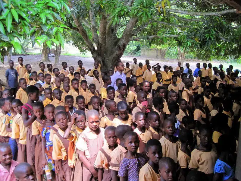 Students sitting outside in Ghana.