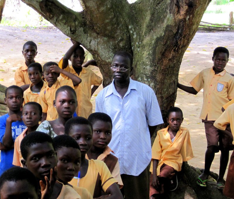 Ghanaian students under a tree.