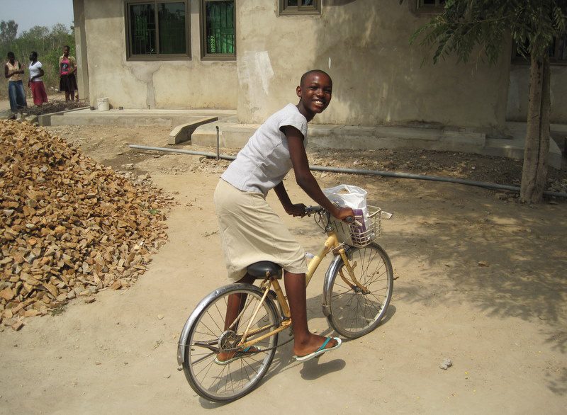 On her bike in Sogakope, Ghana.