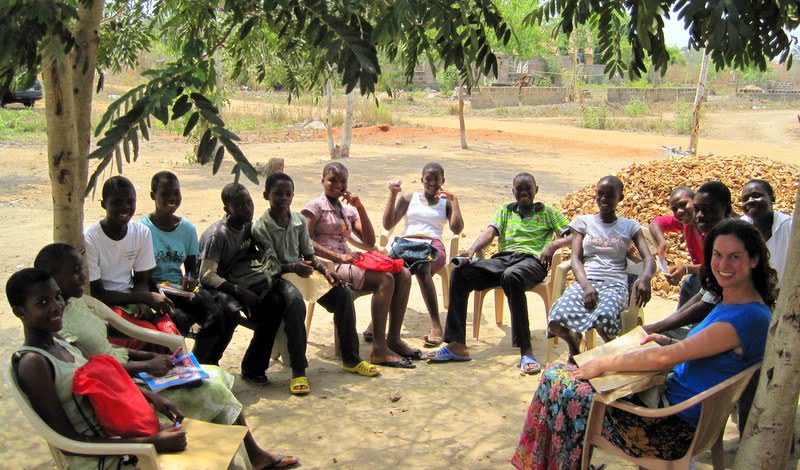 Students in Ghana gathering for an outdoor lesson.