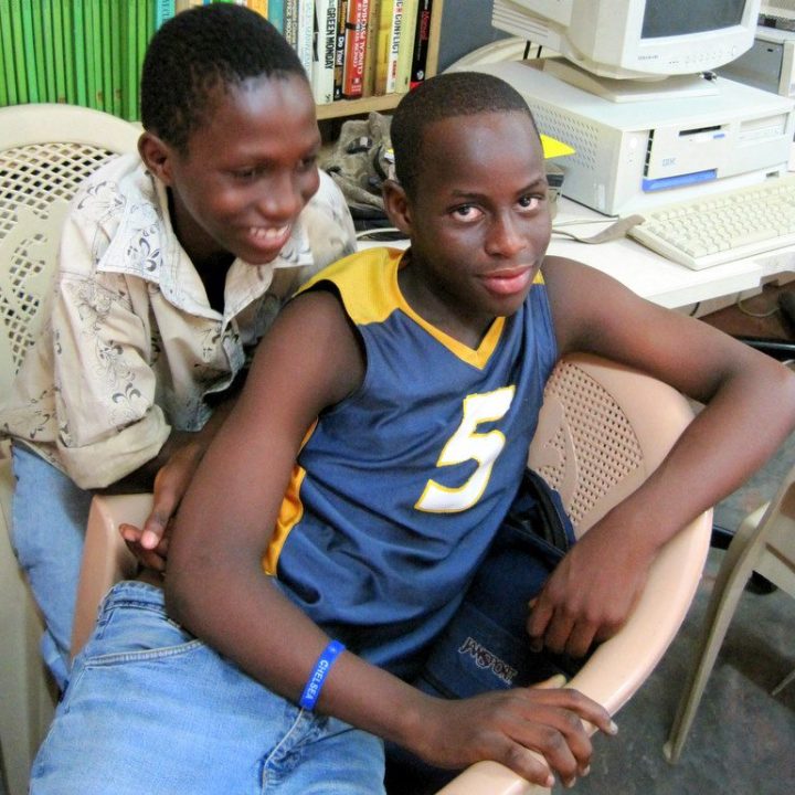 Praise with a classmate in Ghana.