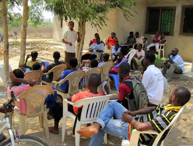Students gathering in Ghana for a lesson.