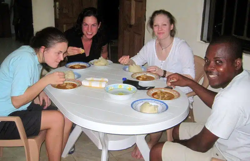 Gathering around the table in Ghana.