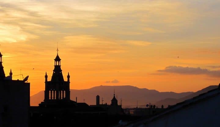The sun sets over Granada, Spain.