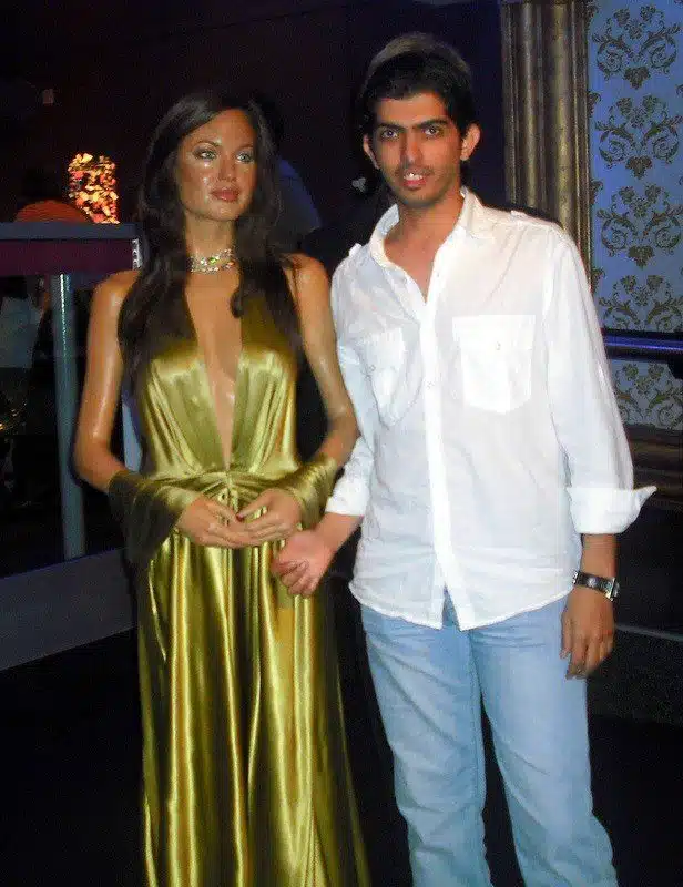 With Angelina Jolie! Can you see Brad's hair behind Faisal?