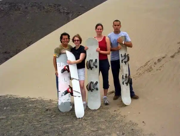 Gareth and I prepare to sandboard with our Peruvian brothers.
