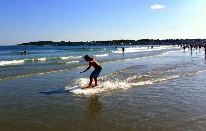 Sliding along the surf at Narragansett Beach, Rhode Island.