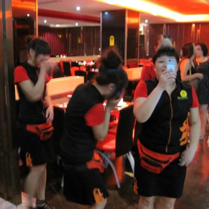 Waitresses giggling and photographing us in Yunyang.