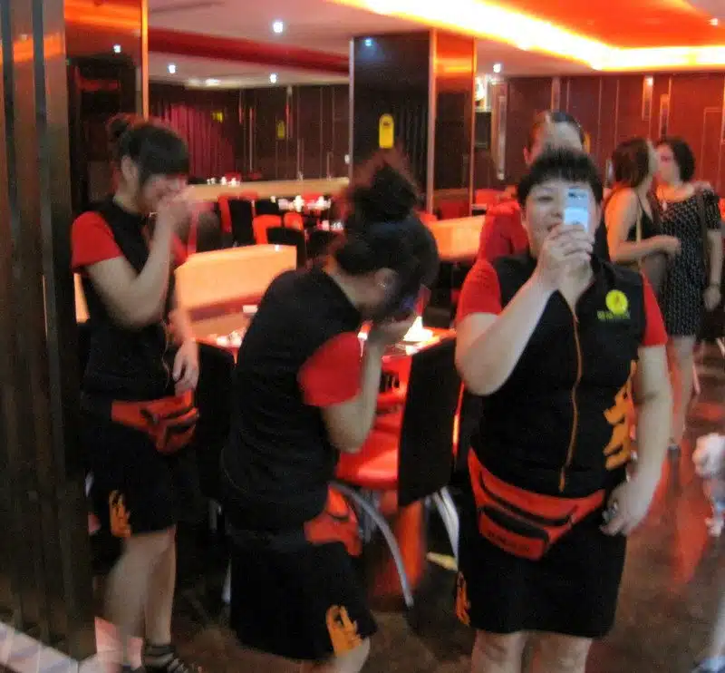 Waitresses giggling and photographing us in Yunyang.