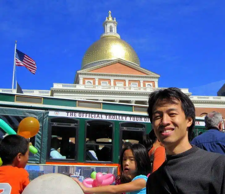 My friend Angel in front of the State House and tour bus.
