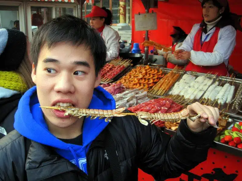 Eating centipede. Look at all the meats in the background!
