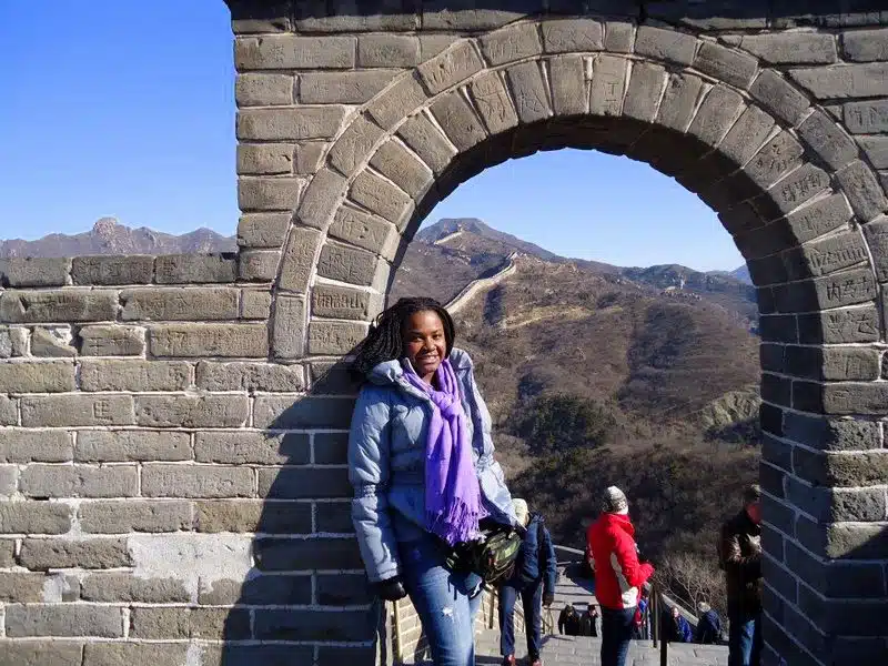 Stephane, triumphantly atop the Great Wall of China.