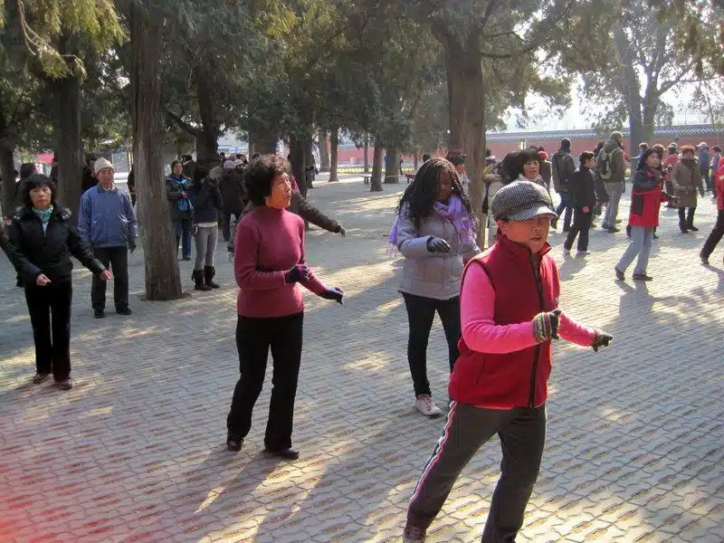 LOVE this photo of Stephane dancing to Britney Spears with locals during their daily exercise in Tiantan Park.