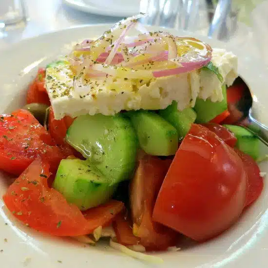 Greek Salad: Feta, tomato, cucumber, onion, and olive oil.