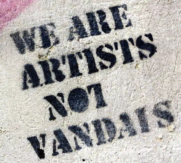 Graffiti in Nafplio, Greece, about how graffiti is actually art, not vandalism.