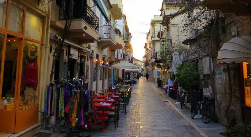 The stores and restaurants of Nafplio beckon for you to enter.