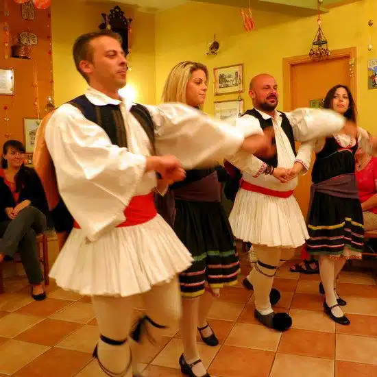 Traditional Greek dancing with traditional fluffy white Man Skirts.