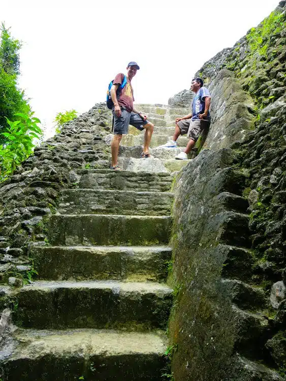 Colin climbing the Xunantunich Mayan ruins with our great guide.