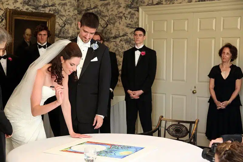 Before the wedding ceremony, the Bride and Groom sign the Ketubah: the Jewish wedding contract.