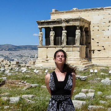 With the famous statues at the Acropolis, mimicking their serious expressions.