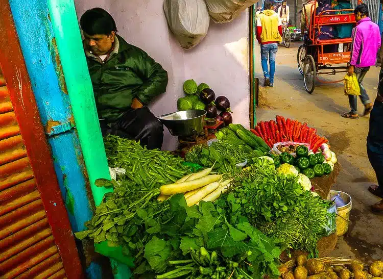 Does this vendor's jacket make him look like one of his green peppers?