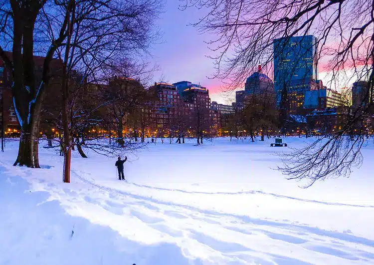 Boston Public Garden under snow at sunset