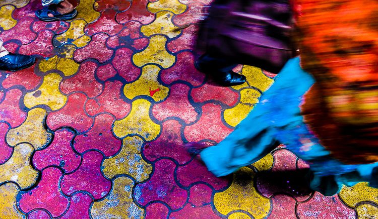 Even the ground in Old Delhi is colorful and ornate.