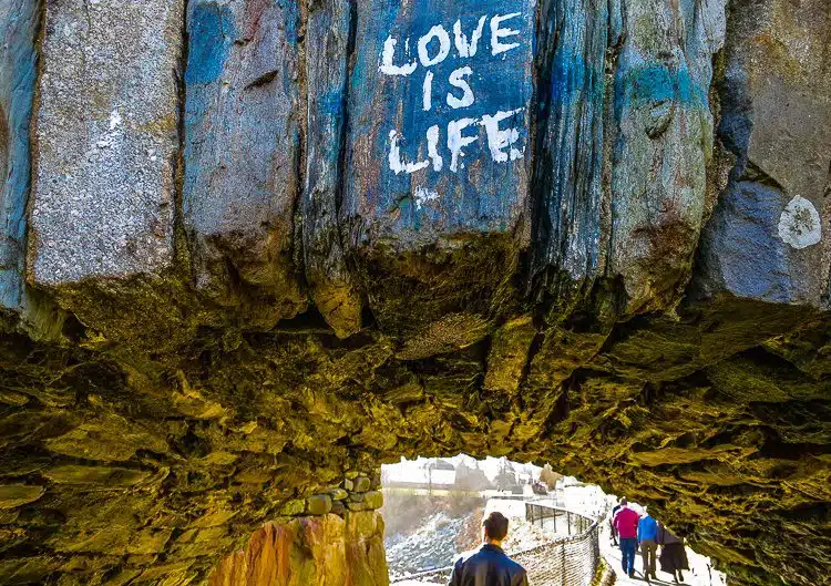Graffiti on a tunnel in the Cliff Walk behind the mansions. Is Love life, or is Money?