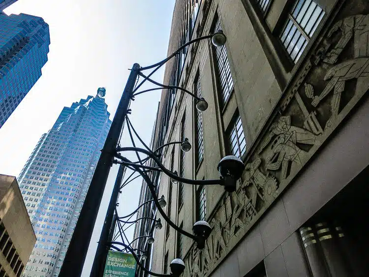 The old Toronto Stock Exchange smiles at the new glass buildings. 