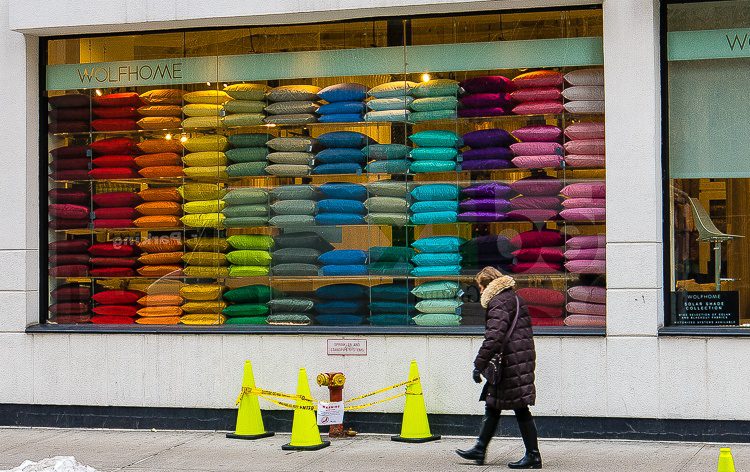 Colors of commerce brightened the muddy snow of Manhattan.