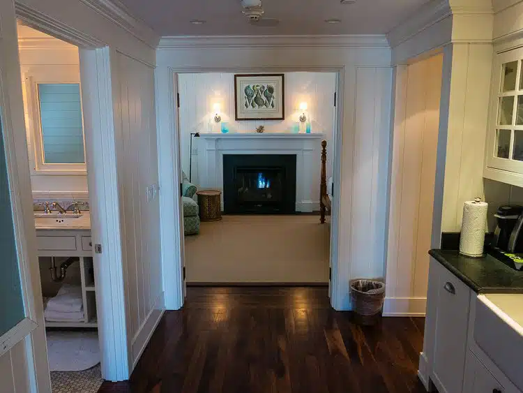 The hallway of our cottage, displaying the fireplace in the bedroom!