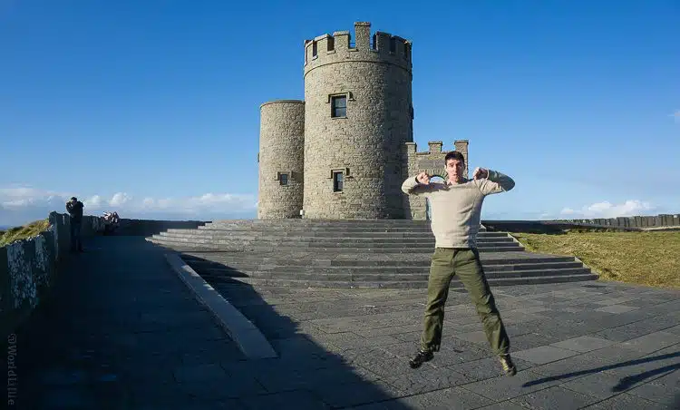 Mid-jump, wearing the "Rawkus Pant" at the Cliffs of Moher.