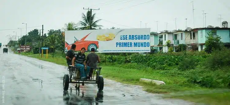 This buggy in front of a "That absurd First World" billboard sums up Cuba's current situation to me.