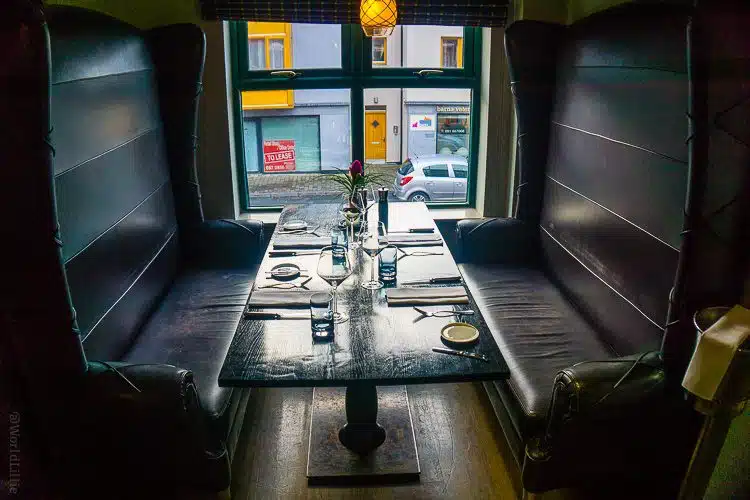 Check this out: In the restaurant Upstairs at West, these seats can face each other...