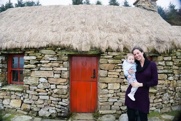 Snuggly in my sweater dress with baby at the Dan O'Hara Homestead in Connemara, Ireland.