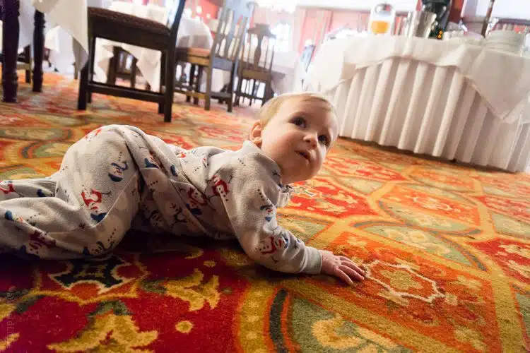 Baby Devi was entranced by the patterned carpet.
