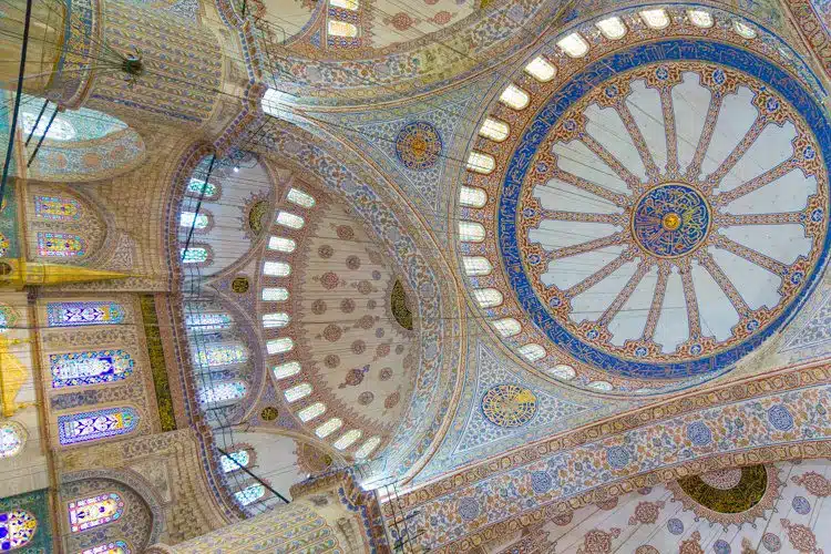 Looking right up at the mosque's domed ceiling.