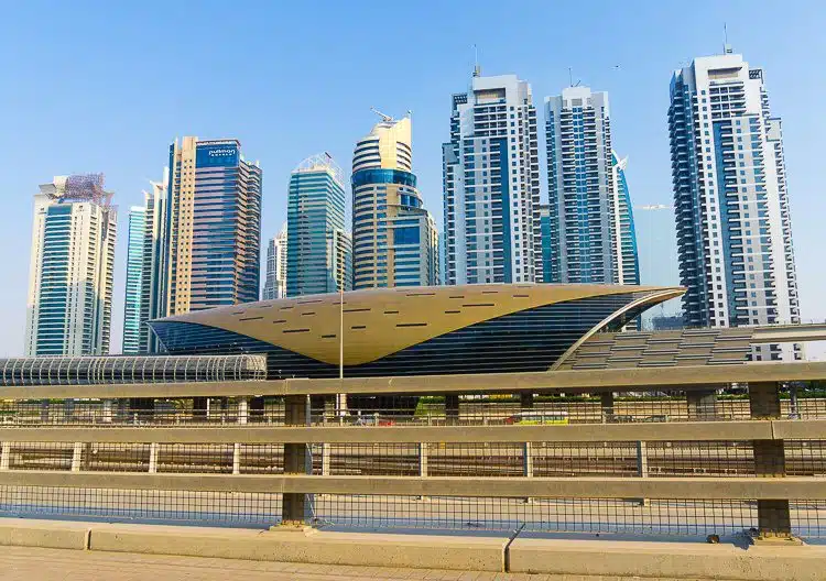 Dubai is known for its luxury skyscrapers, framed here by a Metro station.