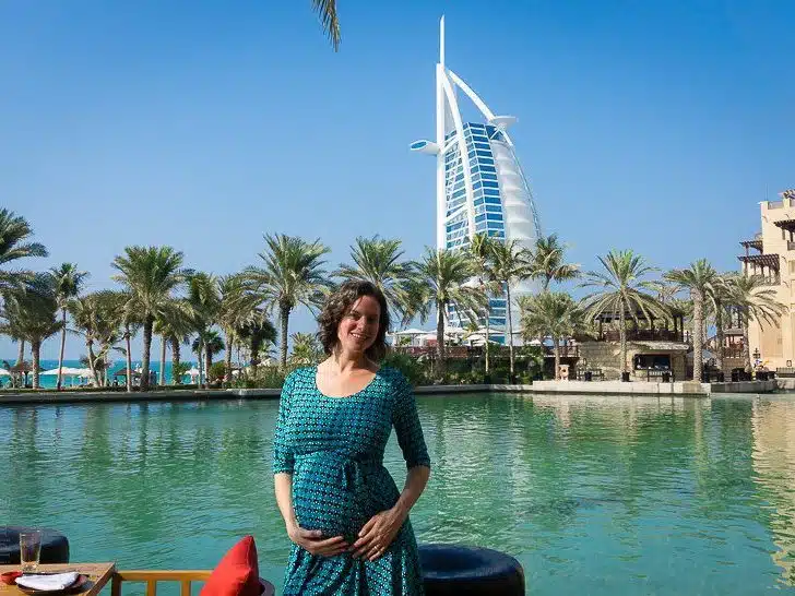 Pregnantly enjoying the iconic Dubai view of the Burj Al Arab building.