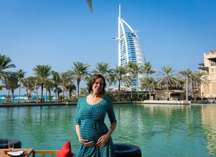 Pregnantly enjoying the iconic Dubai view of the Burj Al Arab building.