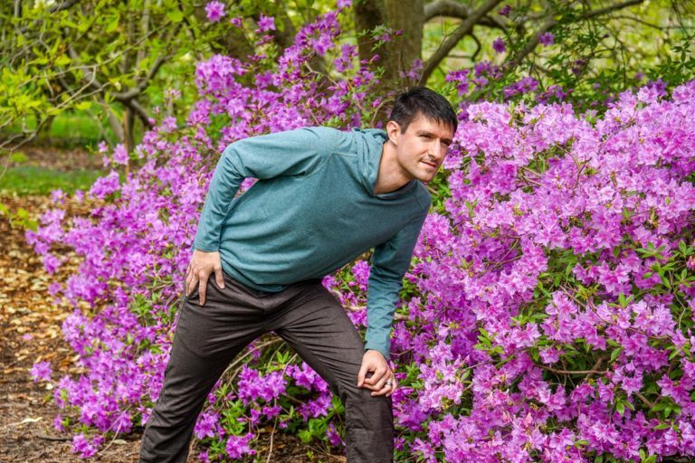 "Pretend to smell the flowers, but tilt to model the clothes!"
